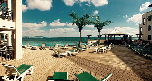 green loungers on dock at daytime